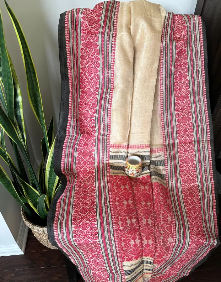 Beige Nobokothi Saree with Red Intricate Motifs and Black Striped Borders Beige Nobokothi Saree with Red Intricate Motifs and Black Striped Borders
